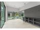 Contemporary mud room with backyard views, custom shelving, and space for outdoor gear at 16320 Pendio Dr, Bella Collina, FL 34756
