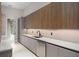 Convenient pantry area featuring sleek countertops and ample storage cabinetry and dishwasher at 16320 Pendio Dr, Bella Collina, FL 34756