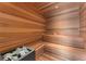 Relaxing sauna room featuring all-wood construction and multi-tiered benches at 16320 Pendio Dr, Bella Collina, FL 34756