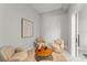 Cozy sitting area with neutral-toned furnishings, soft lighting, and stylish decor at 16320 Pendio Dr, Bella Collina, FL 34756