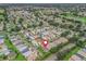 Community aerial view highlighting the home's location near lush greenery and water features at 17461 Se 82Nd Albemarle Ave, The Villages, FL 32162