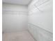 Walk-in closet with wire shelving, providing ample storage space for clothing and accessories at 17461 Se 82Nd Albemarle Ave, The Villages, FL 32162