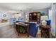 Cozy living area flowing into the kitchen, perfect for relaxing and entertaining at 17461 Se 82Nd Albemarle Ave, The Villages, FL 32162
