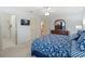 Comfortable main bedroom featuring a TV, en-suite bathroom and ample storage at 17461 Se 82Nd Albemarle Ave, The Villages, FL 32162