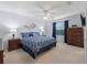 Inviting main bedroom with carpet, large window and traditional furniture at 17461 Se 82Nd Albemarle Ave, The Villages, FL 32162