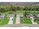Aerial view of a beautiful home, showcasing its well-kept lawn and the surrounding neighborhood at 1824 Forest Glen Dr, Fruitland Park, FL 34731