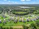 The home is situated on a well-manicured lawn within a community and backs up to the woods at 1824 Forest Glen Dr, Fruitland Park, FL 34731