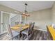 Dining area featuring wood floors and stylish furnishings, adjacent to stairs at 1824 Forest Glen Dr, Fruitland Park, FL 34731