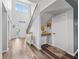 Bright foyer with hardwood floors and staircase, showcasing the home's entryway at 1824 Forest Glen Dr, Fruitland Park, FL 34731