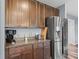 Kitchen featuring countertops, stainless steel appliances, and dark wood cabinets at 1824 Forest Glen Dr, Fruitland Park, FL 34731