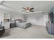 Spacious main bedroom featuring a tray ceiling, neutral decor, and large closet at 1824 Forest Glen Dr, Fruitland Park, FL 34731