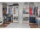 Well-organized walk-in closet with ample storage, built-in shelving, and a full-length mirror at 1824 Forest Glen Dr, Fruitland Park, FL 34731