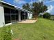 Expansive backyard with a fountain, lush green lawn, and serene view at 20936 Royal St Georges Ln, Leesburg, FL 34748