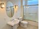 Well-maintained bathroom with tiled shower and a classic vanity at 20936 Royal St Georges Ln, Leesburg, FL 34748
