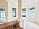 Bright dining room featuring elegant column accents and an abundance of natural light at 20936 Royal St Georges Ln, Leesburg, FL 34748