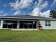 Exterior view of the house with a fountain, backyard and awning at 20936 Royal St Georges Ln, Leesburg, FL 34748