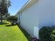 Exterior view of the house with manicured lawn and landscaping at 20936 Royal St Georges Ln, Leesburg, FL 34748