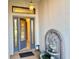 Arched entryway with leaded glass door and an antique tiered fountain at 20936 Royal St Georges Ln, Leesburg, FL 34748
