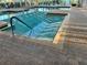 Indoor pool with access stairs for relaxation, enjoyment, and convenient year-round swimming at 20936 Royal St Georges Ln, Leesburg, FL 34748