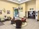 Open lobby with wicker seating, decorative fixtures, and a grand entrance, creating an elegant and inviting space at 20936 Royal St Georges Ln, Leesburg, FL 34748