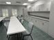 Versatile meeting room with long tables and ample storage for gatherings and events at 20936 Royal St Georges Ln, Leesburg, FL 34748