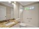 Bathroom featuring tiled shower over tub, window, vanity, and tile floors at 2104 Gerardo Ave, The Villages, FL 32159