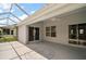 Outdoor lanai featuring white floors, ceiling fan, and screened walls at 2104 Gerardo Ave, The Villages, FL 32159