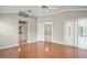 Bright main bedroom with hardwood floors, a ceiling fan, and an ensuite bathroom at 2104 Gerardo Ave, The Villages, FL 32159