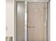 Modern shower showcasing glass doors, tiled walls, and a chrome showerhead at 2104 Gerardo Ave, The Villages, FL 32159
