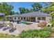 Inviting backyard showcasing a beautiful pool, patio furniture, and open access to the interior at 2214 Dogwood Cir, Mount Dora, FL 32757