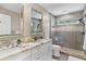 Beautiful bathroom featuring double sinks, granite counters and glass enclosed shower at 2214 Dogwood Cir, Mount Dora, FL 32757