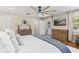 Spacious bedroom features wood floors, natural light and a large bed at 2214 Dogwood Cir, Mount Dora, FL 32757