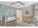 This cozy Bedroom features a crib, changing table and plenty of space for your little one to play at 2214 Dogwood Cir, Mount Dora, FL 32757