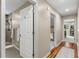 Hallway featuring hardwood floors leading to bedrooms and bathrooms at 2214 Dogwood Cir, Mount Dora, FL 32757