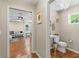 Hallway view to the powder room and living room at 2214 Dogwood Cir, Mount Dora, FL 32757