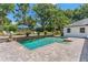 Inviting backyard pool with stone accents and lush landscaping at 2214 Dogwood Cir, Mount Dora, FL 32757