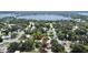 Aerial view of a tree-lined neighborhood home close to the lake at 2237 Washington Rd, Mount Dora, FL 32757