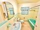 Bathroom has a sink, toilet, bathtub and matching tile and fixtures at 2237 Washington Rd, Mount Dora, FL 32757