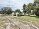 Charming single-Gathering home boasting a well-maintained lawn and established landscaping at 2237 Washington Rd, Mount Dora, FL 32757