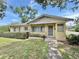 Charming single-story home with a well-maintained front yard and walkway leading to the entrance at 2237 Washington Rd, Mount Dora, FL 32757