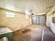 A spacious, unfinished garage with concrete floors and cinder block walls awaits customization at 2237 Washington Rd, Mount Dora, FL 32757
