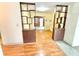 A view through a room divider showing the kitchen and living room at 2237 Washington Rd, Mount Dora, FL 32757