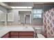 Bathroom featuring a vanity, a toilet, and a mirror at 24 Brigadoon Cir, Leesburg, FL 34788