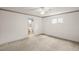 Carpeted main bedroom with ensuite bath at 24 Brigadoon Cir, Leesburg, FL 34788
