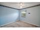Bedroom with neutral carpeting and a window at 24 Brigadoon Cir, Leesburg, FL 34788