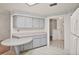 Spacious kitchen with light gray cabinets, ample counter space, and an adjacent dining area at 24 Brigadoon Cir, Leesburg, FL 34788