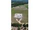 Expansive aerial view of the property showcases the land and building in progress near rural landscape at 2421 Shady Ln, Groveland, FL 34736