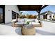 Inviting outdoor patio with comfortable seating, a built-in grill, and a pergola for shade at 2421 Shady Ln, Groveland, FL 34736