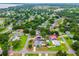 Aerial view showing property location in a residential area with lush trees and water views at 2705 Bayview Dr, Eustis, FL 32726