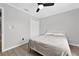 Relaxing bedroom featuring wood-look floors, a ceiling fan, and a closet for storage at 2705 Bayview Dr, Eustis, FL 32726